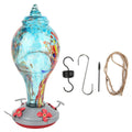 Colorful glass bird feeder with hummingbird design for outdoor gardens, featuring water feeding tools and vibrant colors.