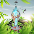 Colorful glass bird feeder with hummingbird design, suitable for garden outdoor use, featuring water feeding tool and vibrant colors.
