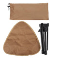Lightweight khaki folding camping stool with 360-degree rotating seat, portable triangular design, suitable for outdoor activities.