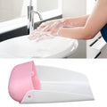 Pink portable faucet extender spout for toddler hand washing, designed for children's outdoor play and easy use.