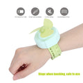 Green cartoon watch-shaped mini kid wrist fan with adjustable strap, USB charging, designed for children, by Everything Baby.