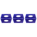 Blue ceramic tile leveler clips and wedges for wall and floor tiling, used with construction and tiling supplies.