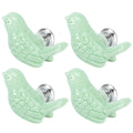 Green ceramic bird-shaped knobs, set of four, for DIY door and drawer handles on furniture, suitable for children's changing tables.