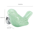 Set of four green ceramic bird-shaped knobs for drawers and cupboards, ideal for children's furniture and DIY projects.