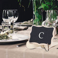 Set of 10 mini wooden chalkboards with black writing surfaces, perfect for wedding or party decoration by Everything Baby.