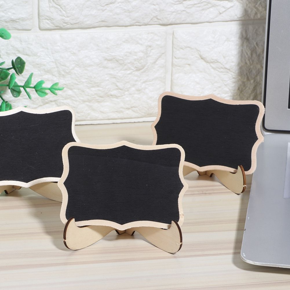 Set of 10 mini wooden chalkboards with black surfaces, ideal for wedding and party decorations, from Everything Baby.