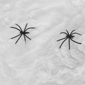 White Halloween spider webs with two fake spiders, perfect for haunted house decorations and spooky scene props.