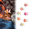 Set of 50 wooden buttons featuring cute fish cartoon patterns for children's handmade crafts and toy projects.