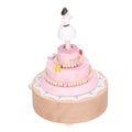 Wooden music box featuring a girl figure, ideal for birthday cake decor and pretend play, by Everything Baby.
