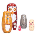 Six handmade cartoon Russian nesting dolls ornaments for kids' pretend play and home decor, from Everything Baby.