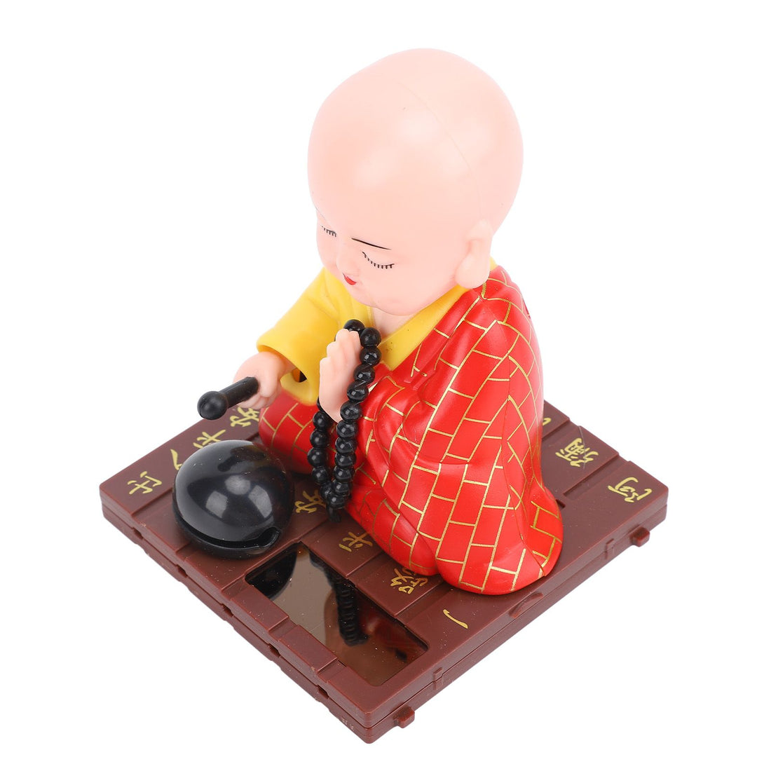 Solar Little Monk figurine with light sensor, energy-saving design, suitable for home, desktop, or car dashboard decoration.