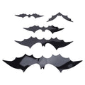 Set of 140 black 3D bat wall decals from Everything Baby, perfect for spooky home or party decoration, with backing sheets included.