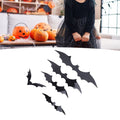 Set of 140 black 3D bat wall decals from Everything Baby, perfect for spooky home or party decoration, featuring backing sheets.