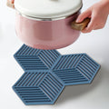 Hexagonal stripe blue heat-insulated coasters set for dining tables, ideal for protecting surfaces from hot cups and tableware.