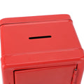 Red metal money bank with lock and keys, creative cute design for kids, used as a cash and coin box for home use.