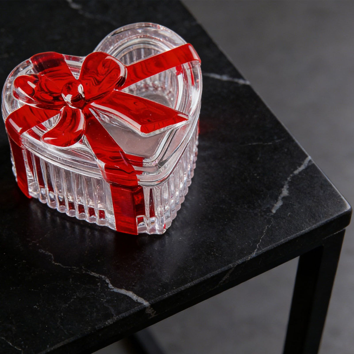 Glass heart-shaped candy jar with red bow lid, clear cookie bowl for snacks, jewelry, and storage, by Everything Baby.