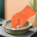 Orange silicone baking finger gloves for microwave oven insulation, designed for safe, non-slip handling in kitchen pretend play.