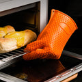 Orange silicone baking finger gloves for kitchen insulation, designed for pretend play with baby and kids' toy kitchen accessories.