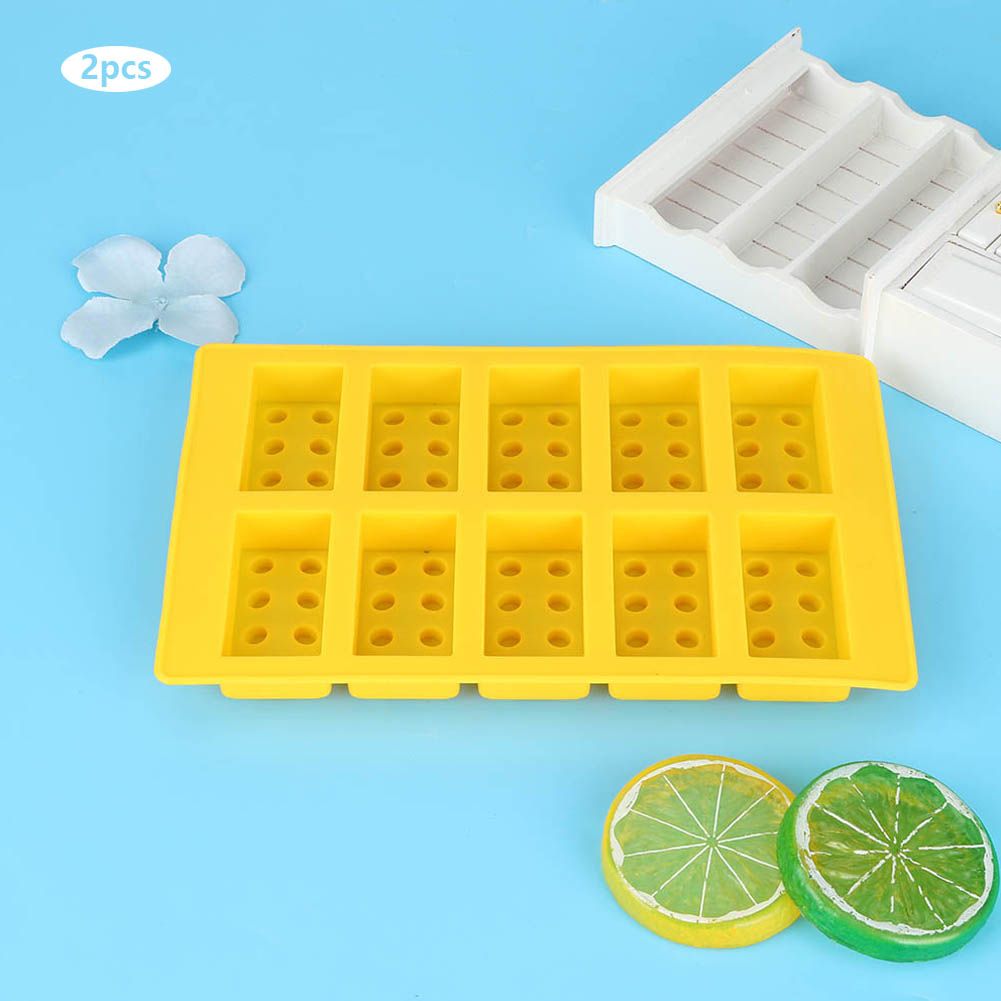 Yellow silicone ice cube mold with 10-grid design for DIY ice making, suitable for drinks and fun baby and kids building toys.