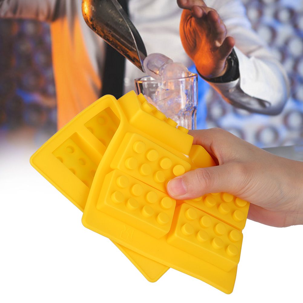 Yellow silicone ice cube mold with 10-grid design for DIY ice making, suitable for kids' play and creative projects.