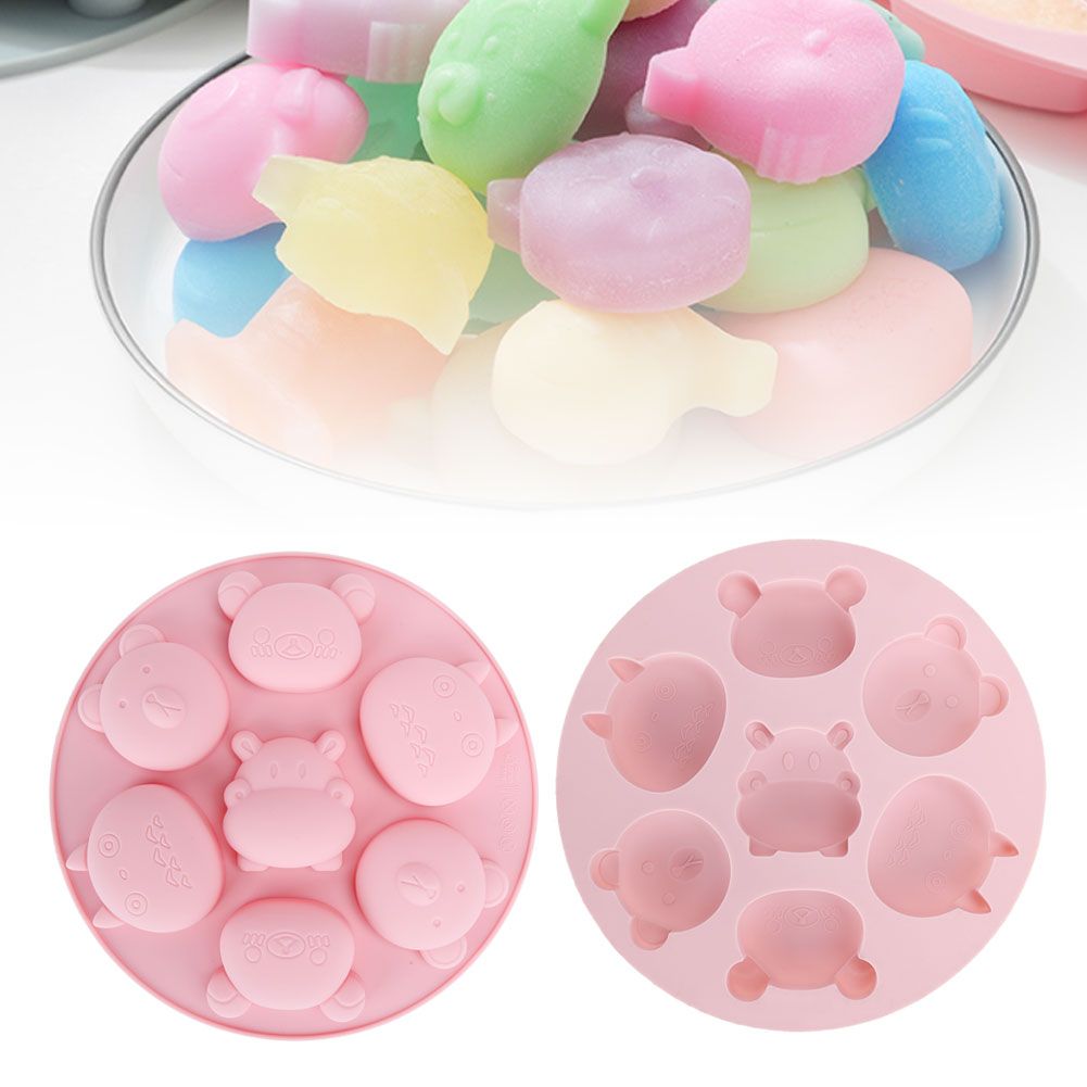 Pink silicone mold with cartoon animal shapes for cake and chocolate baking, ideal for kids' pretend play and baking activities.
