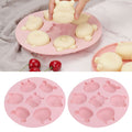 Pink silicone mold with cartoon animal shapes for baking, ideal for cake and chocolate decorations, from Everything Baby.