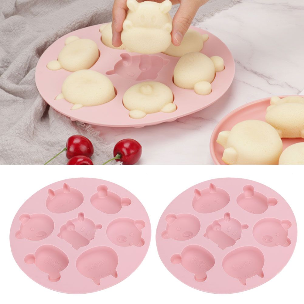 Pink silicone mold with cartoon animal shapes for baking, ideal for cake and chocolate decorations, from Everything Baby.