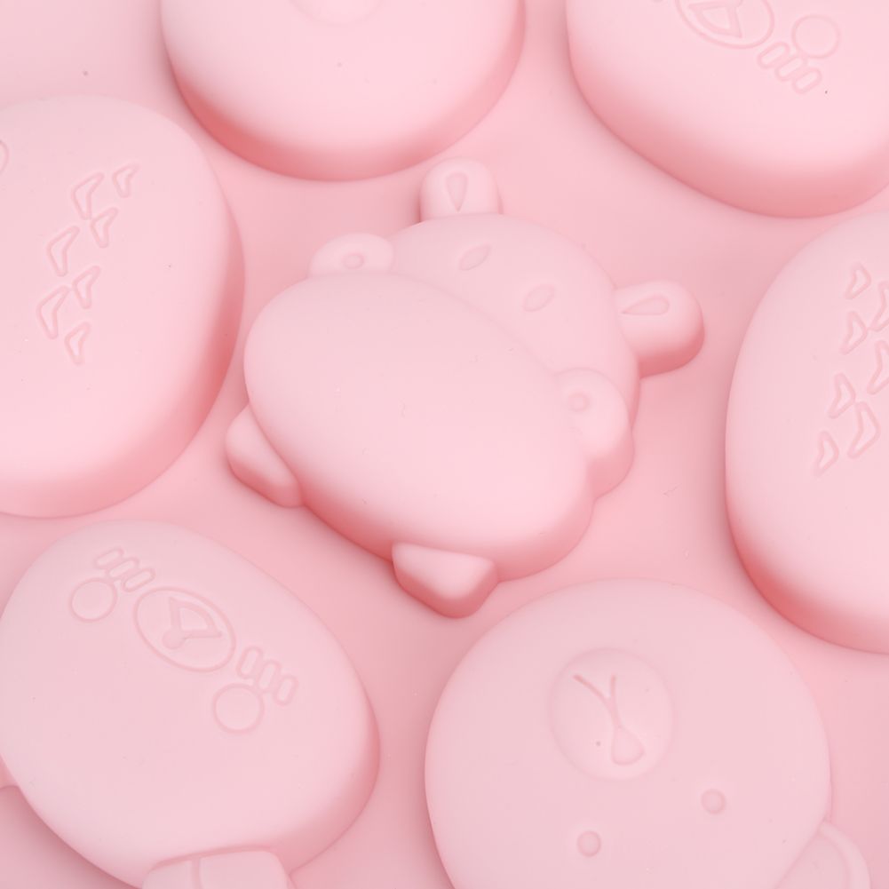 Pink silicone mold featuring cartoon animal shapes for cake, chocolate, and baking, ideal for kids' pretend play baking activities.