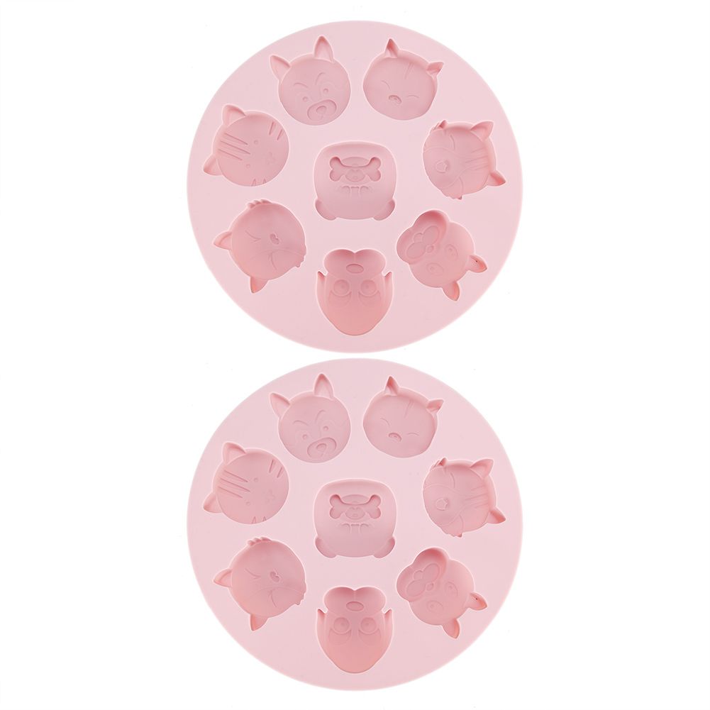 Pink silicone mold with cartoon animal shapes for baking and chocolate making, ideal for kids' cake and snack decorations.