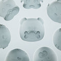 Gray silicone mold featuring cartoon animal shapes for baking and cake decorating, ideal for baby and kids' treats.