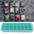 Green silicone ice tray with 24 small cubes and PP lid, ideal for pretend play in baby and kids' toy kitchen activities.