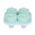 Light green silicone ice cube mold tray with four rose-shaped compartments for making decorative ice cubes at home or bar.