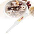 Portable electronic salinity tester pen for vegetable soup saltiness, lightweight and easy to use for baby food preparation.