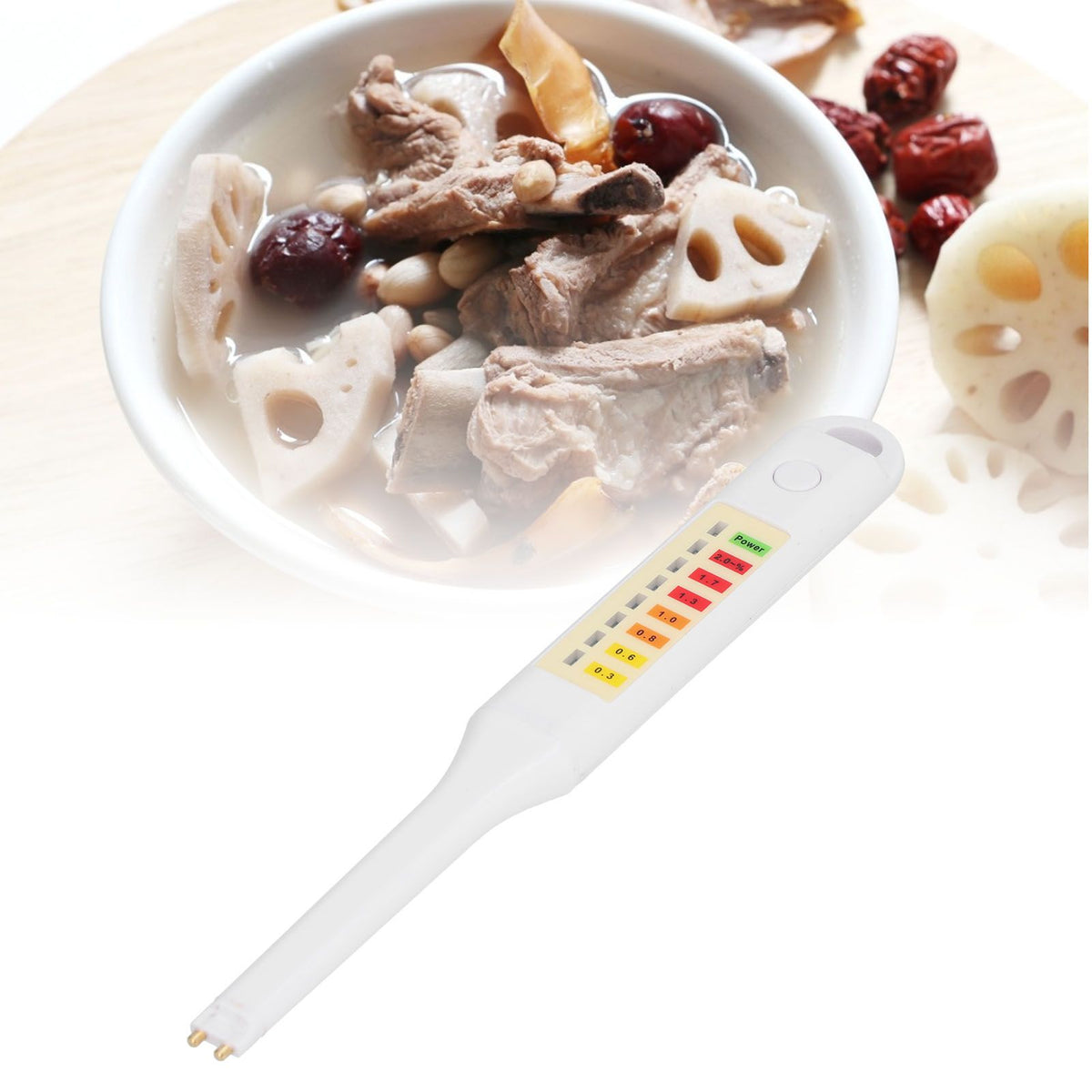 Portable electronic salinity tester pen for vegetable soup saltiness, lightweight and easy to use for baby food preparation.