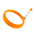 Orange silicone round egg ring for easy, reusable cooking of fried eggs and pancakes, ideal for breakfast and sandwich making.
