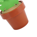 Cute cactus coaster with flowerpot holder, heat insulation and anti-slip features, designed for protecting tabletops in home decor.