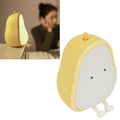 Cartoon pear-shaped LED night light made of silicone, designed for children's bedrooms and living room decor.