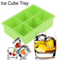 Green silicone ice cube maker with 6 cavities, used for making chocolate or candy molds in kitchen and feeding preparations.