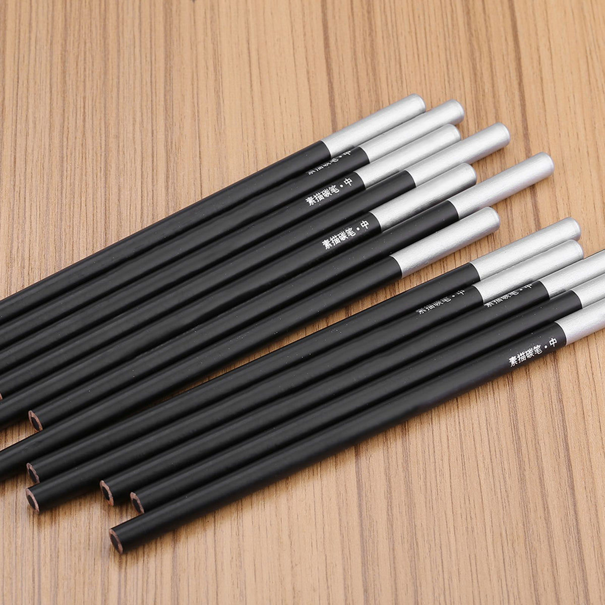 Set of 12 charcoal pencils for art and sketching, professional drawing supplies from Everything Baby, ideal for young artists and students.