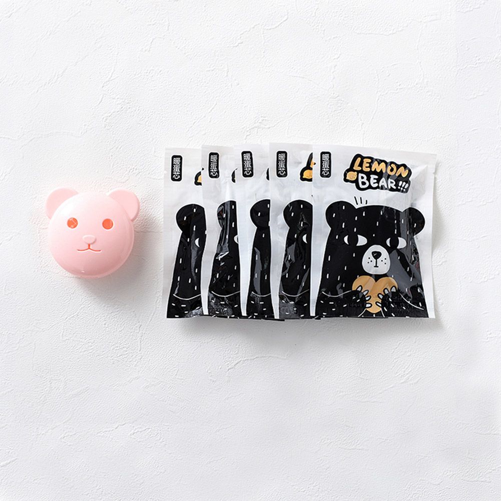 Pink mini bear-shaped hand warmer by Everything Baby, automatic heating, perfect for girls' winter sleepwear and cozy warmth.