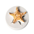 Silicone cake mold featuring conch, starfish, shell, and fishtail shapes from Marine Series by Everything Baby for DIY baking.