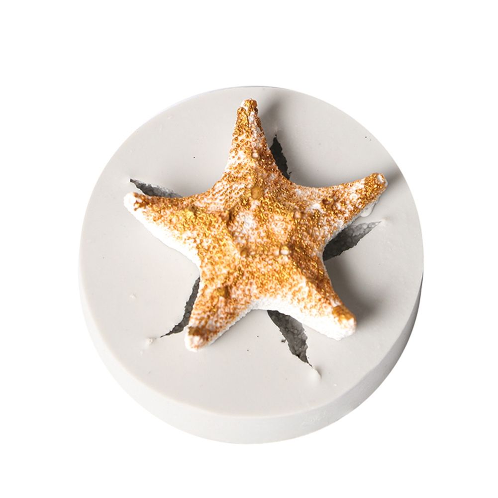 Silicone cake mold featuring conch, starfish, shell, and fishtail shapes from Marine Series by Everything Baby for DIY baking.