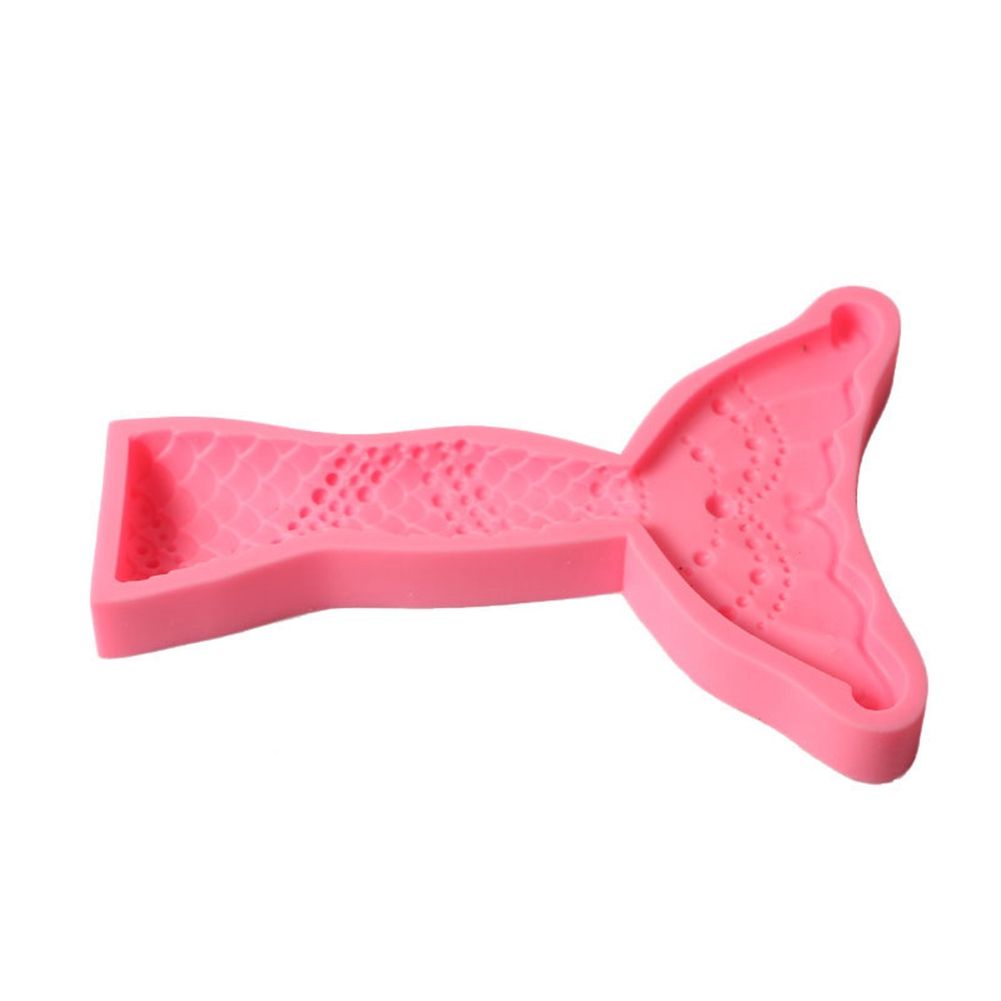 Silicone cake mold featuring conch, starfish, shell, and fishtail designs from the Marine Series by Everything Baby.