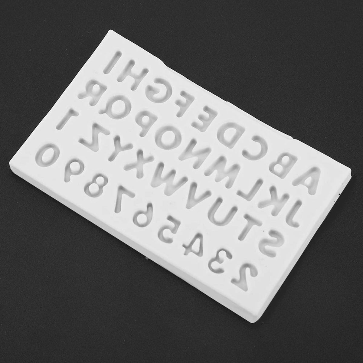 Gray silicone mold with letter shapes for cake decorating, suitable for fondant and chocolate, by Everything Baby.