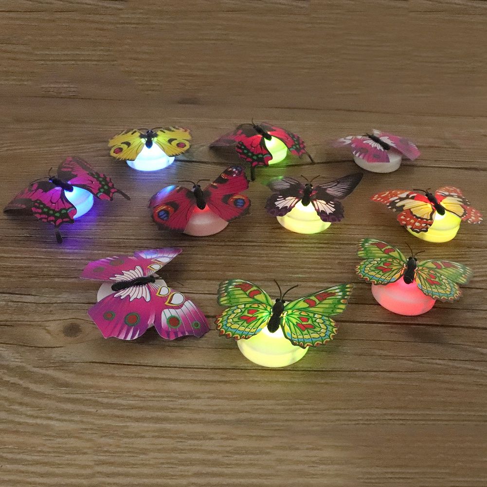 10 glowing butterfly wall decals for kids' rooms, luminous DIY stickers from Everything Baby, perfect for pretend play and bedroom decor.