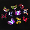 10 glowing butterfly wall decals by Everything Baby, luminous in the dark, perfect for children's pretend play room decor.