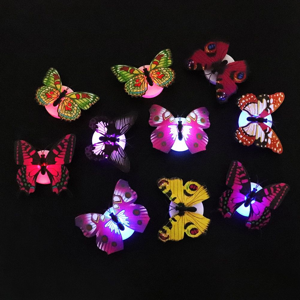 Set of 10 glowing butterfly wall decals for children’s rooms, luminous and perfect for pretend play and room decoration.