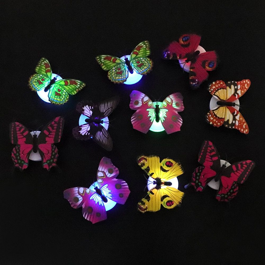 Set of 10 glowing butterfly wall decals from Everything Baby, luminous stickers for kids' pretend play and room decoration.