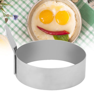 Stainless steel round pancake ring and fried egg mold for kids' pretend play, by Everything Baby, in a playful kitchen setting.