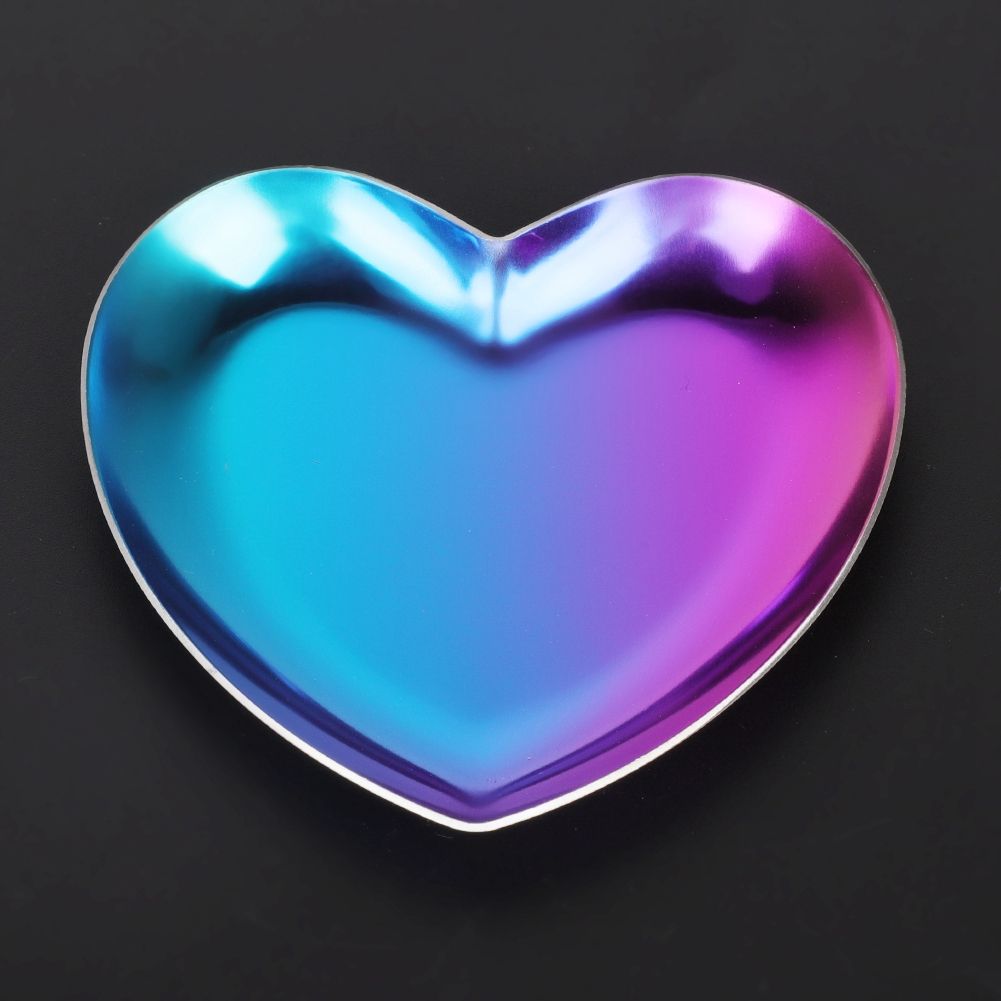 Colorful stainless steel heart-shaped tea and fruit tray from Everything Baby, used as a jewelry or cosmetics organizer for kids.
